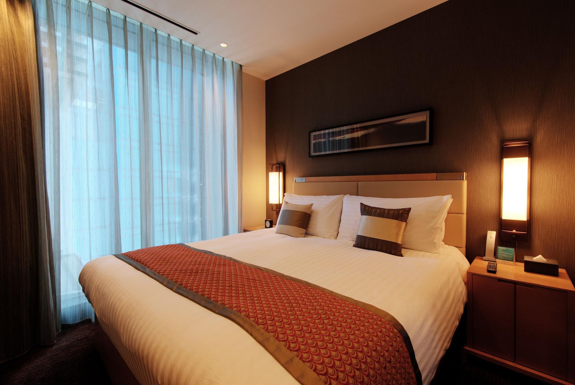 Hotel Oakwood Premier Tokio Exterior foto A bedroom in a hotel